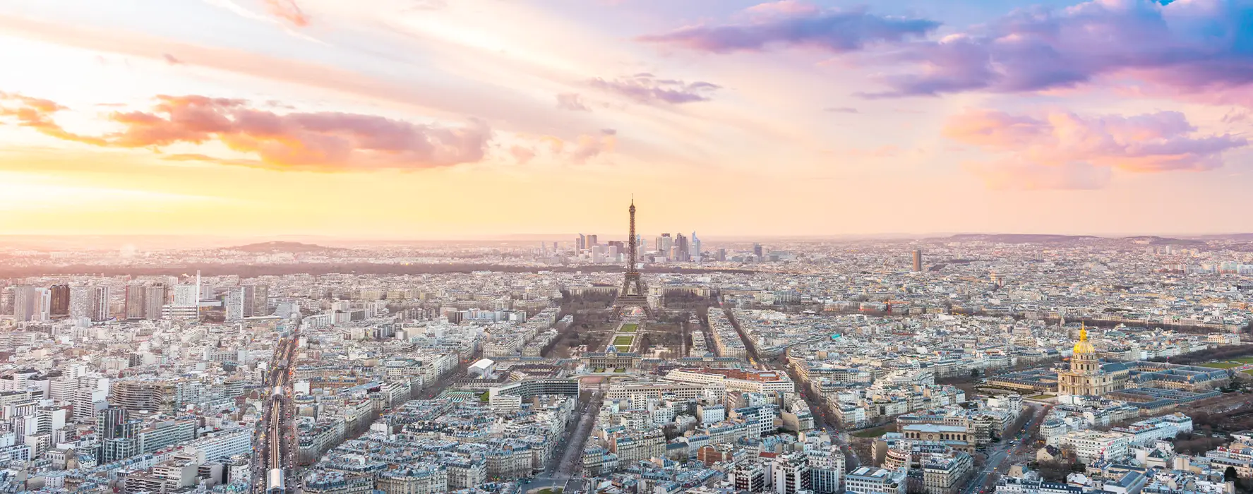 An aerial view of France that features the Eiffel Tower in the center.